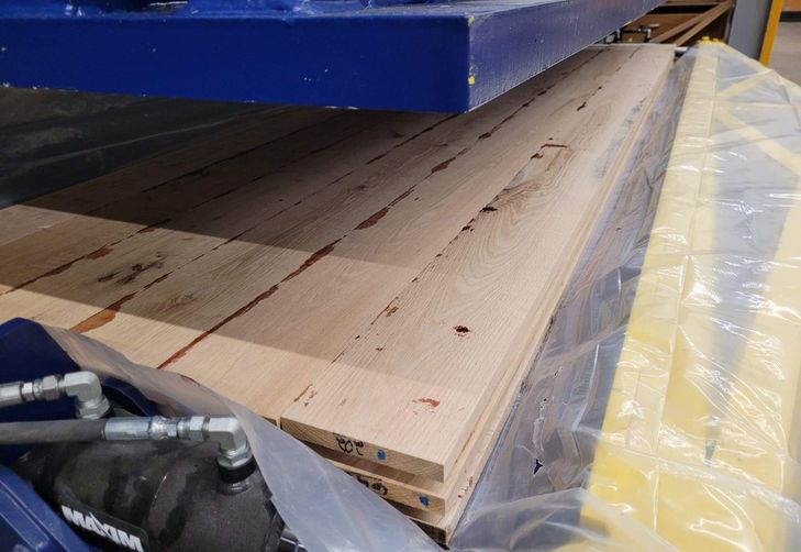 Photo of wood panel being produced. 