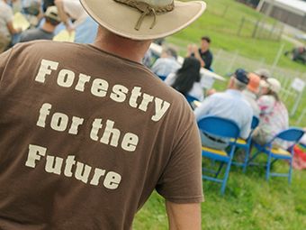 man wearing 'Forestry for the future't-shirt