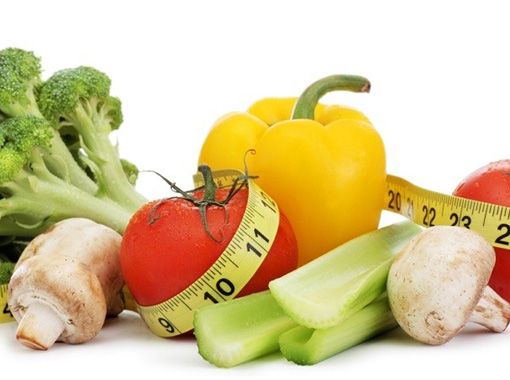 
                Fruits and vegetables surrounded by tape measure
            