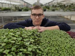 student with microgreens