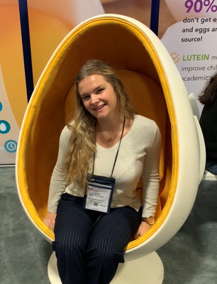 Sarah DeJarnett sits in an egg-shaped chair
