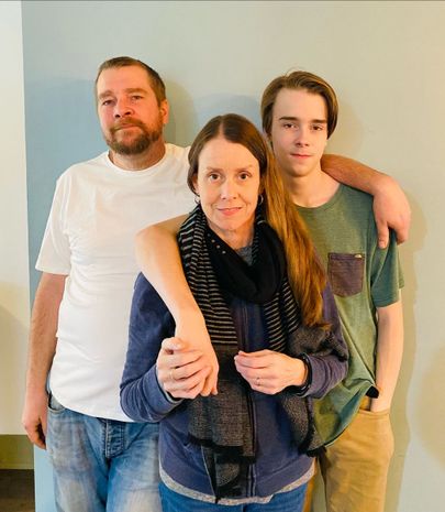 lisa orr standing with husband and son