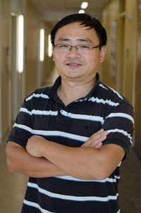 Dr. Cangliang Shen stands for a head shot. 