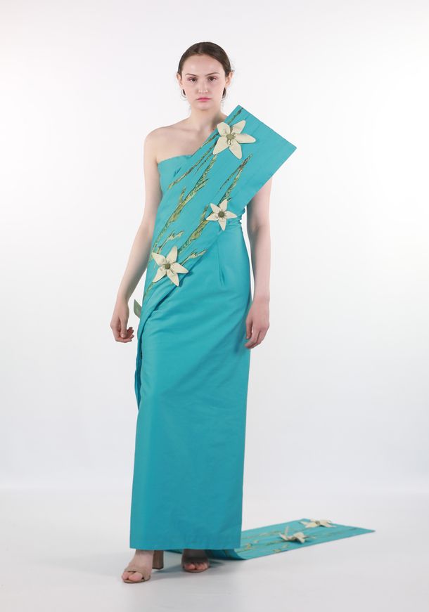 Photo of young woman in teal dress