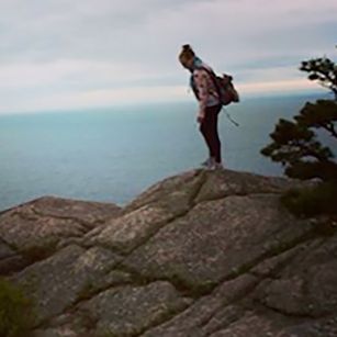 Katie on rocks overlooking ocean