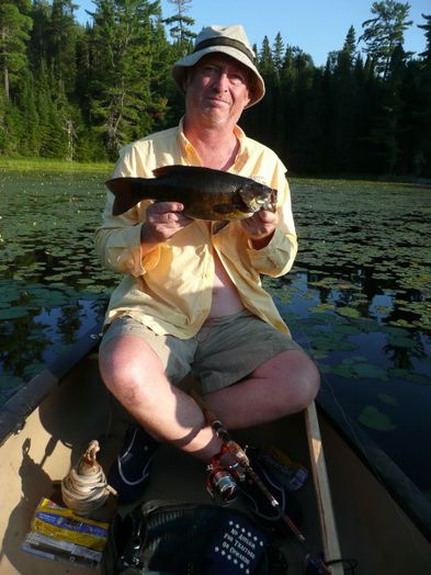 David Davis caught a fish on a lake.