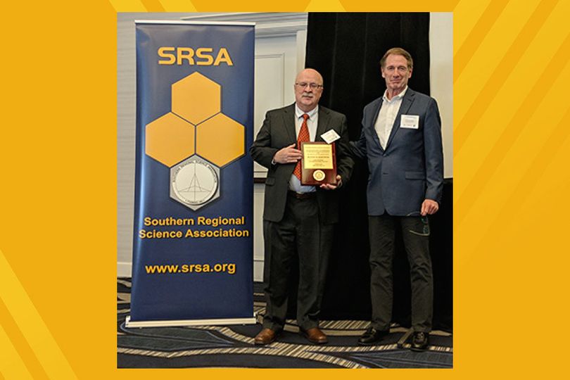Peter Schaeffer accepts SRSA Fellow plaque during the 2018 annual conference in Philadelphia. 