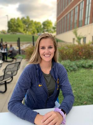 Victoria Eastep sits outside the Agricultural Sciences Building
