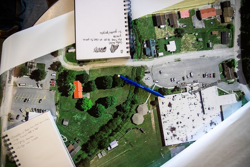 photo of large photo of aerial view of town and notebooks
